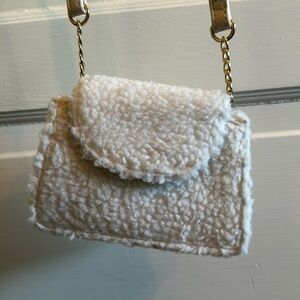 Cream colored fuzzy feel mini bag